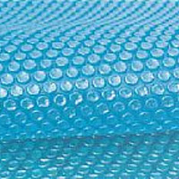 Close-up of a blue solar pool cover featuring raised bubble cells designed to retain heat.